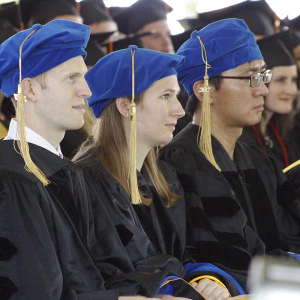 PhD graduates wait to be recognized.