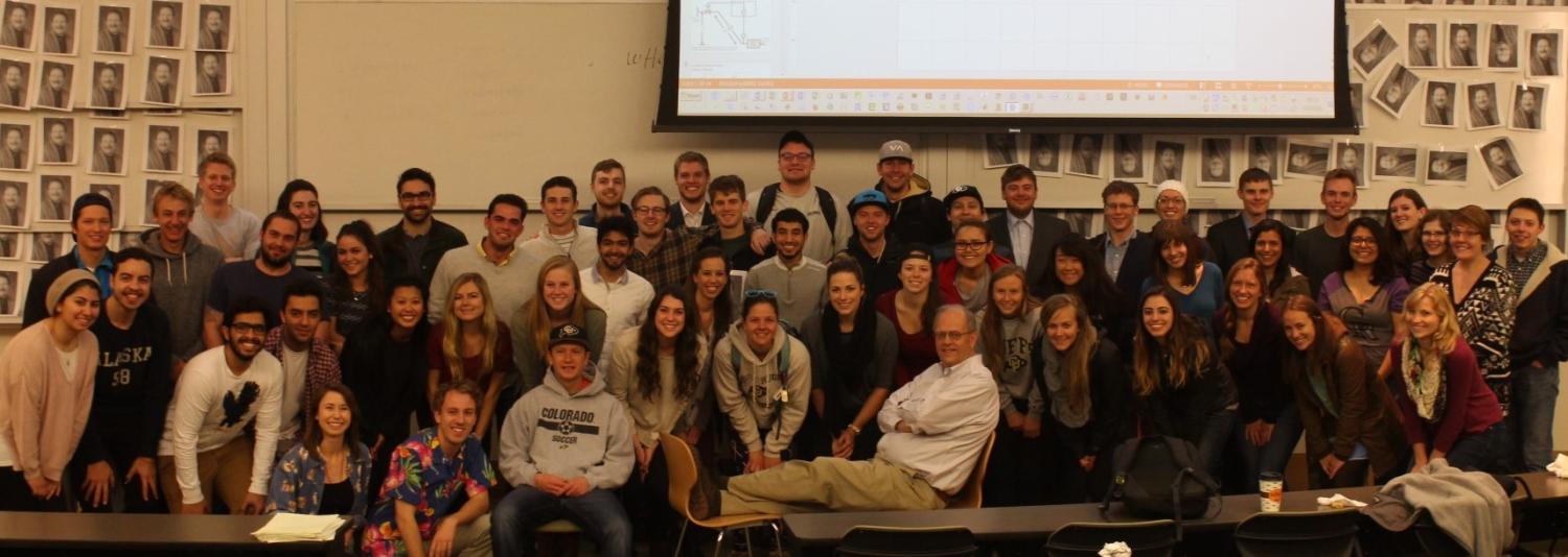 Dave Clough surrounded by his students in 2015