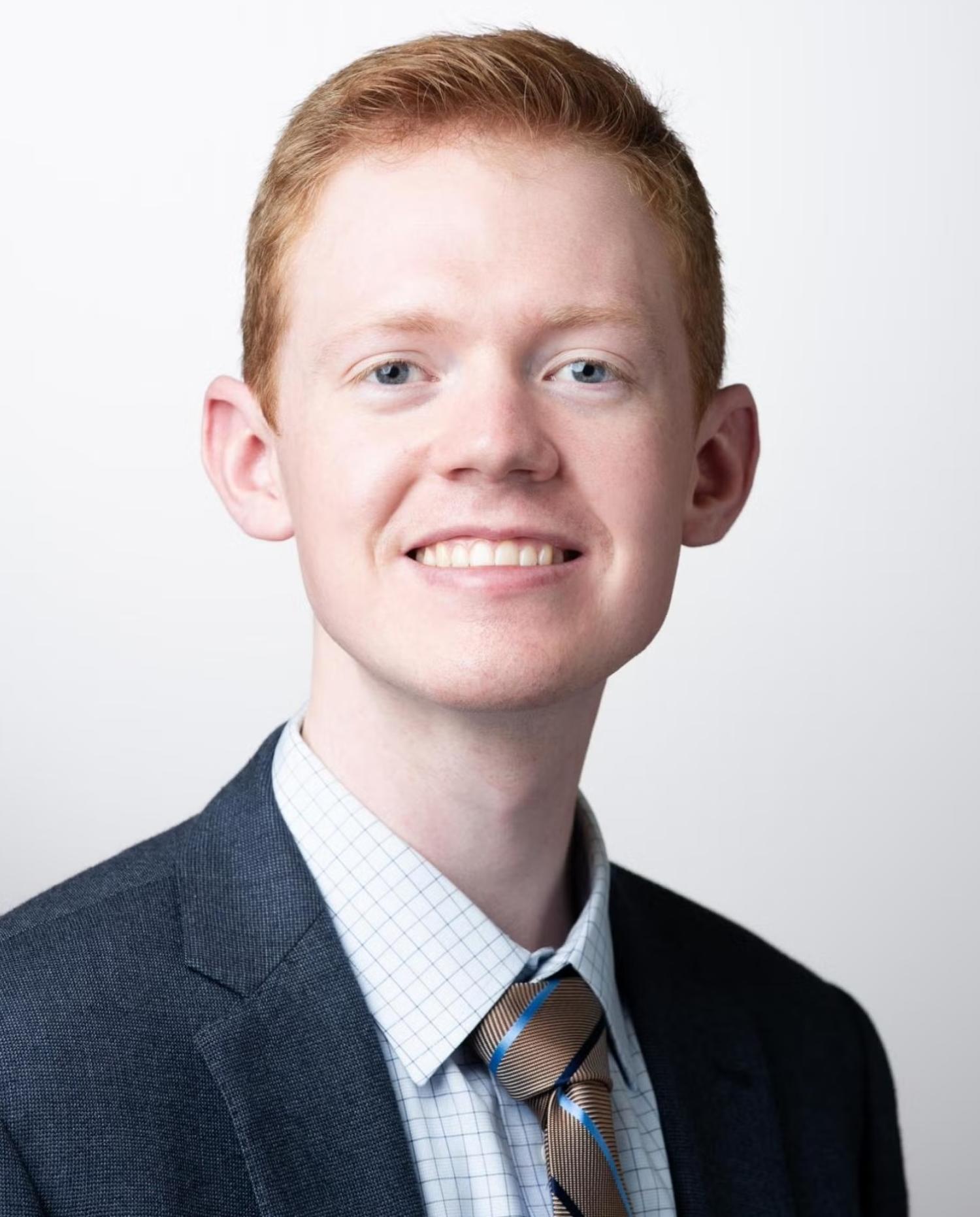 David Conklin in a suit jacket, dress shirt and tie