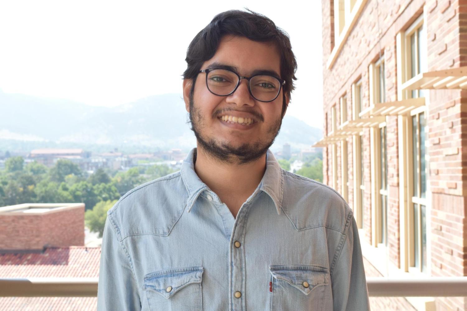 Arkava Ganguly on balcony on CU Boulder campus.
