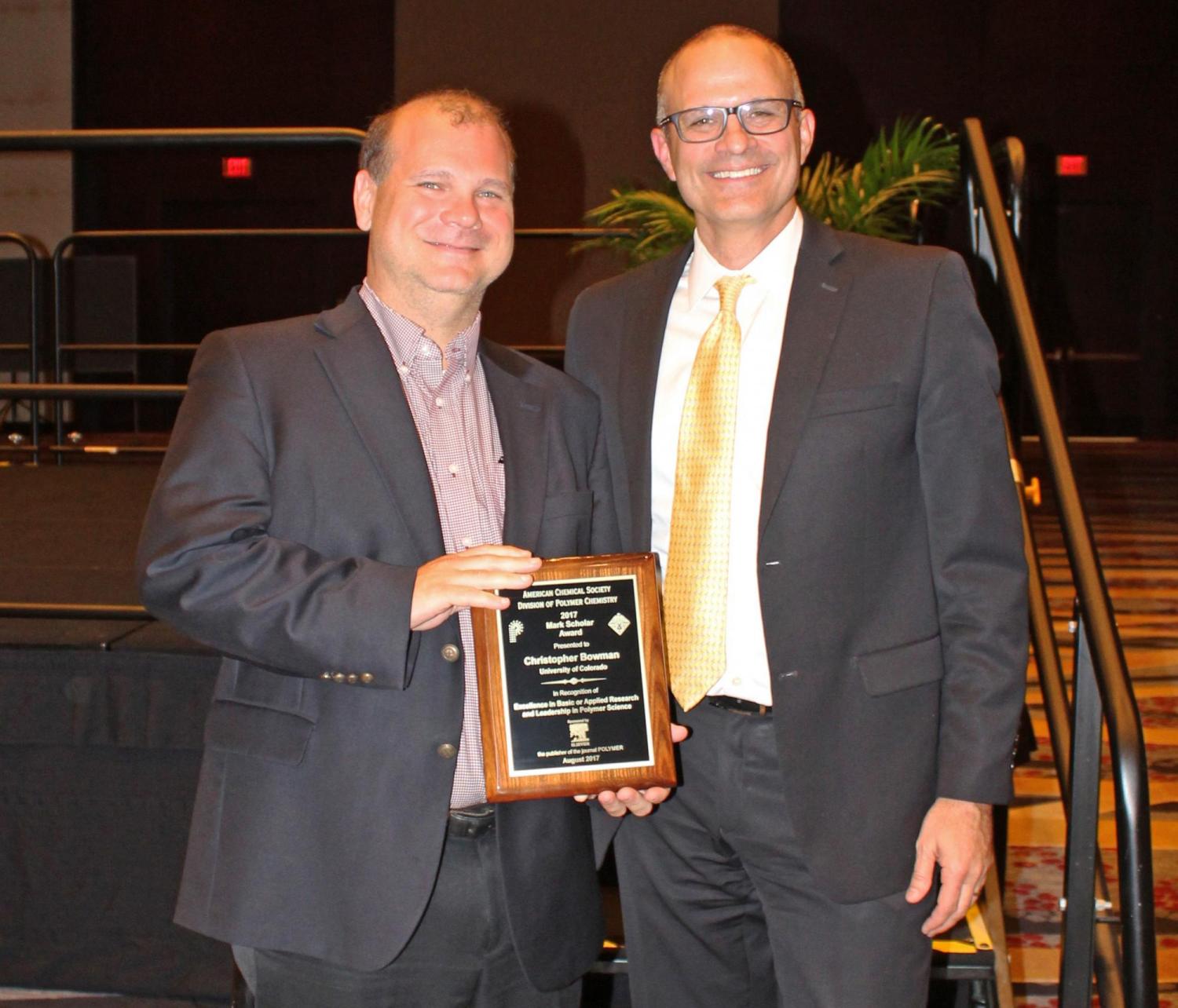 Chris Bowman with award plaque