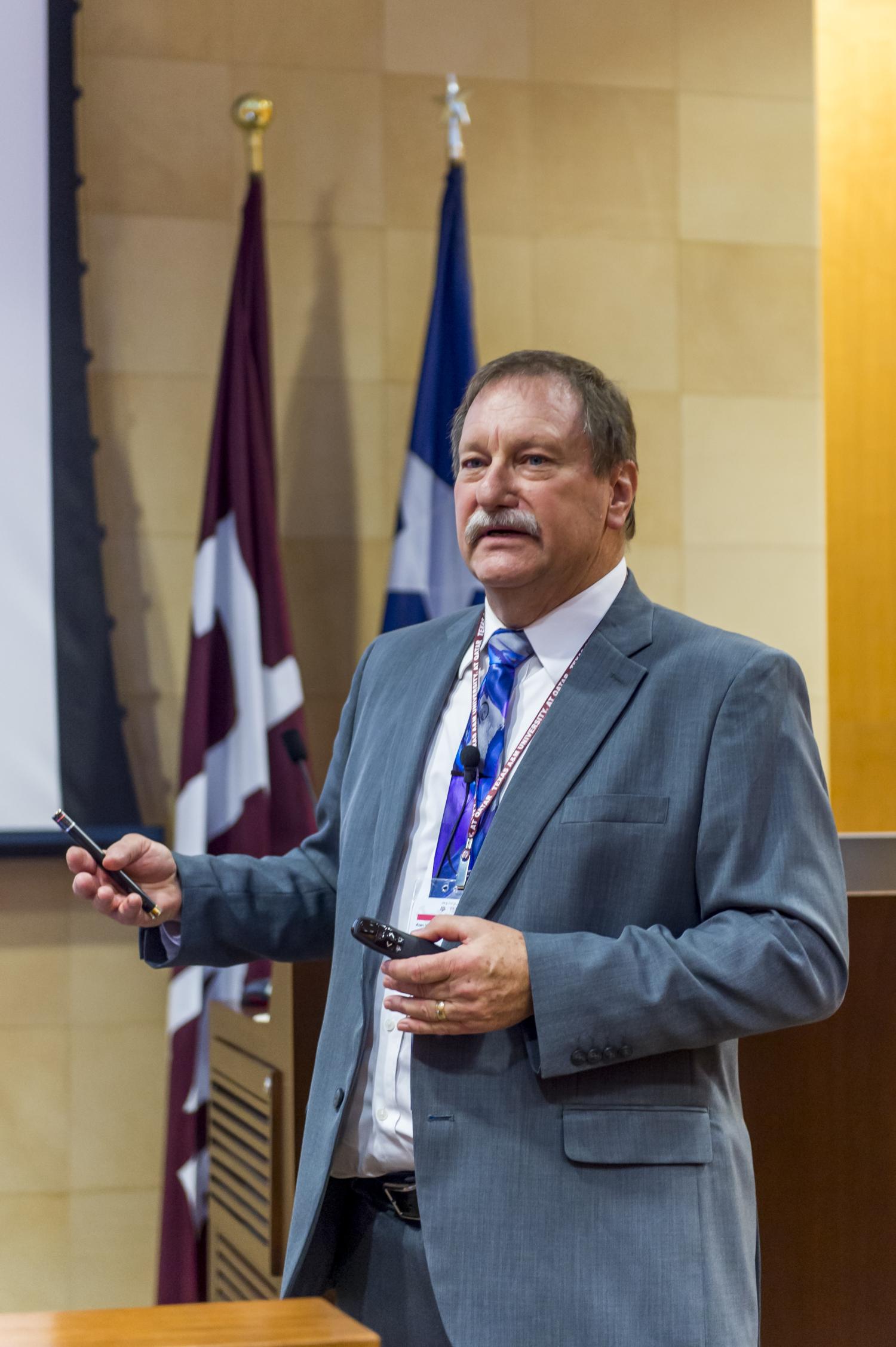 Al Weimer delivering presentation in Qatar
