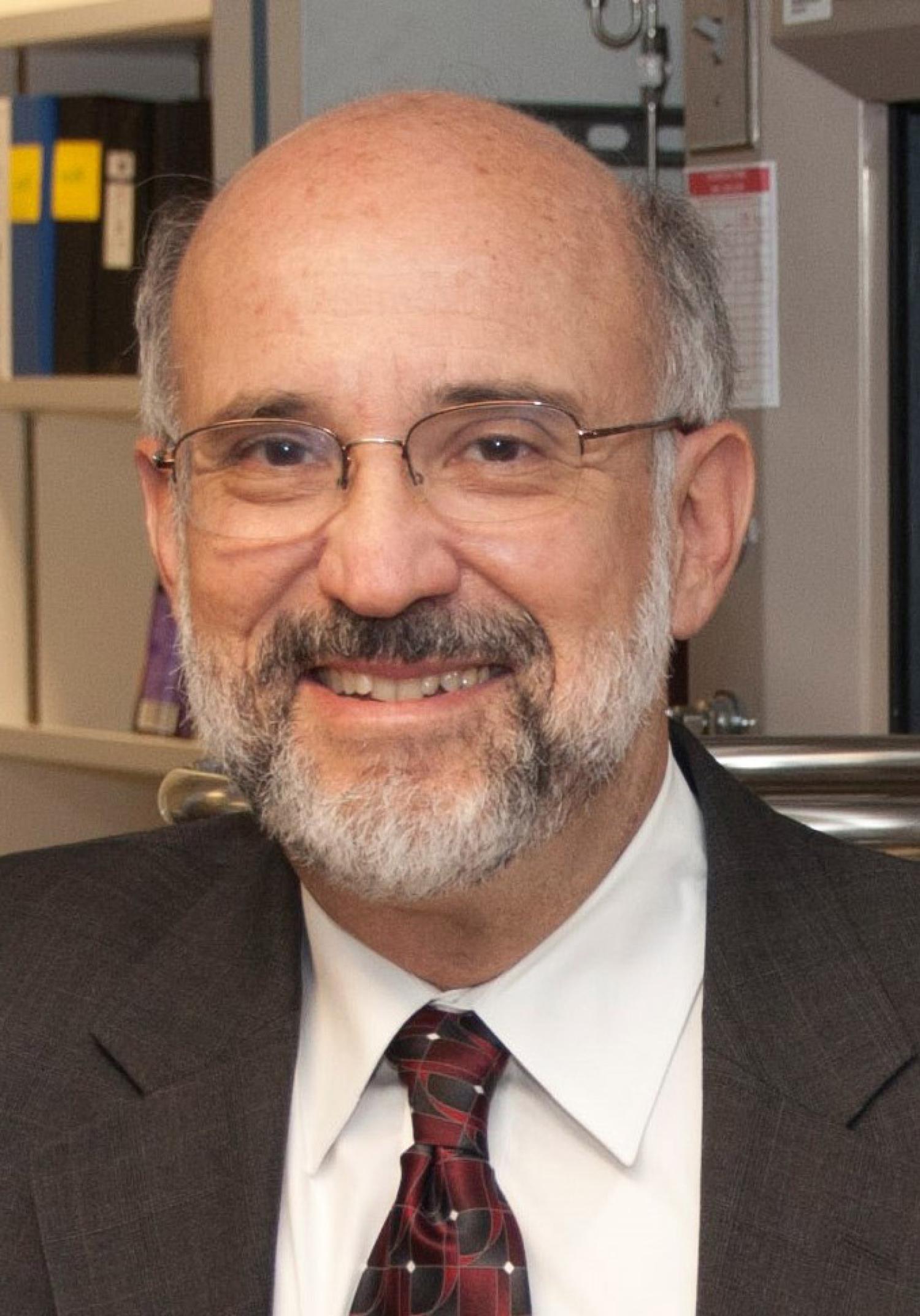 Enrique Iglesia in a jacket and tie