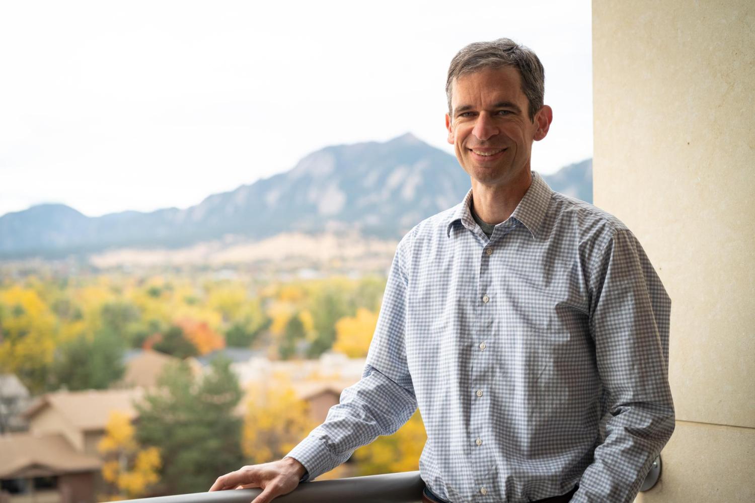 Will Medlin on balcony overlooking Boulder