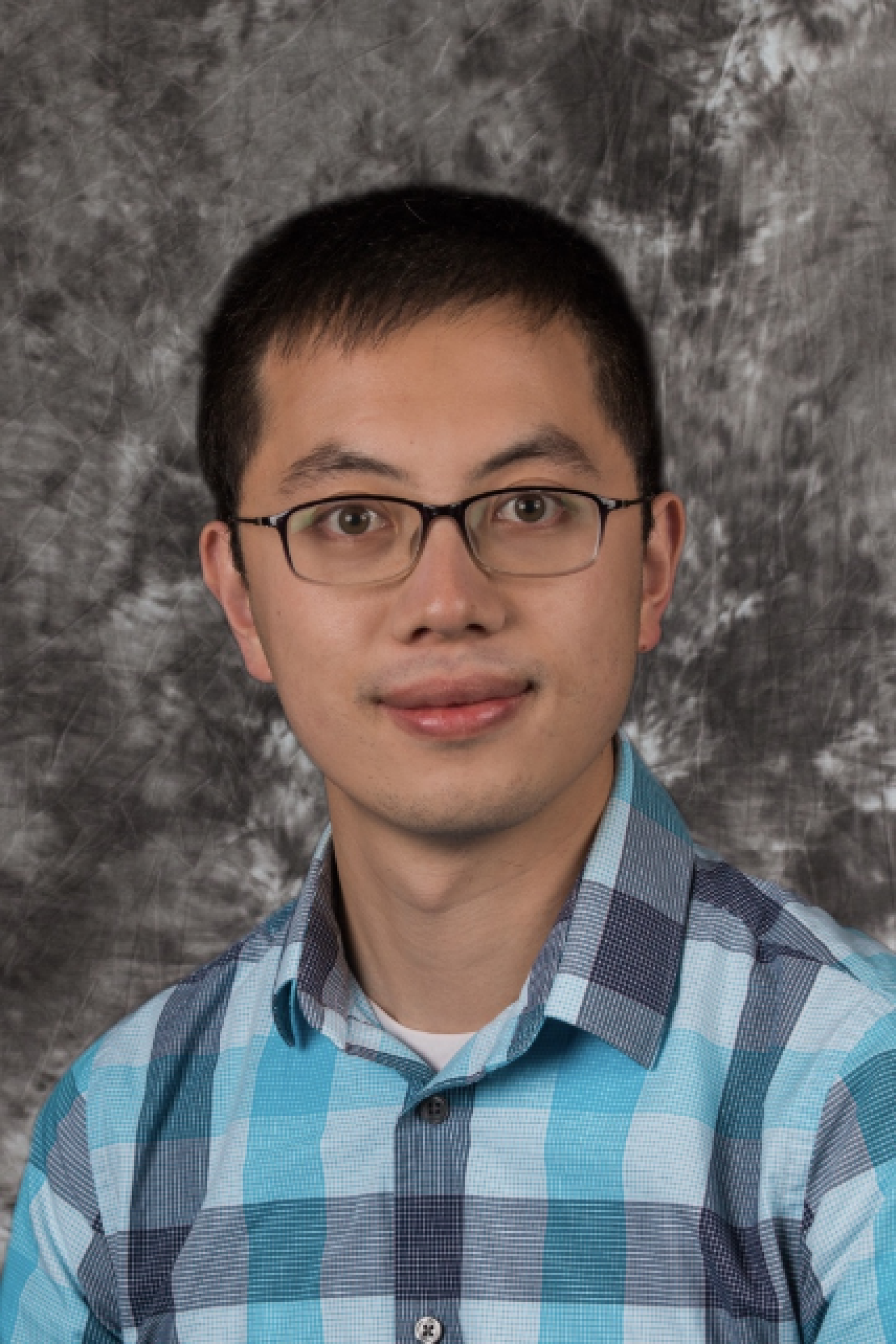 Jiajie Huo in plaid blue and grey shirt