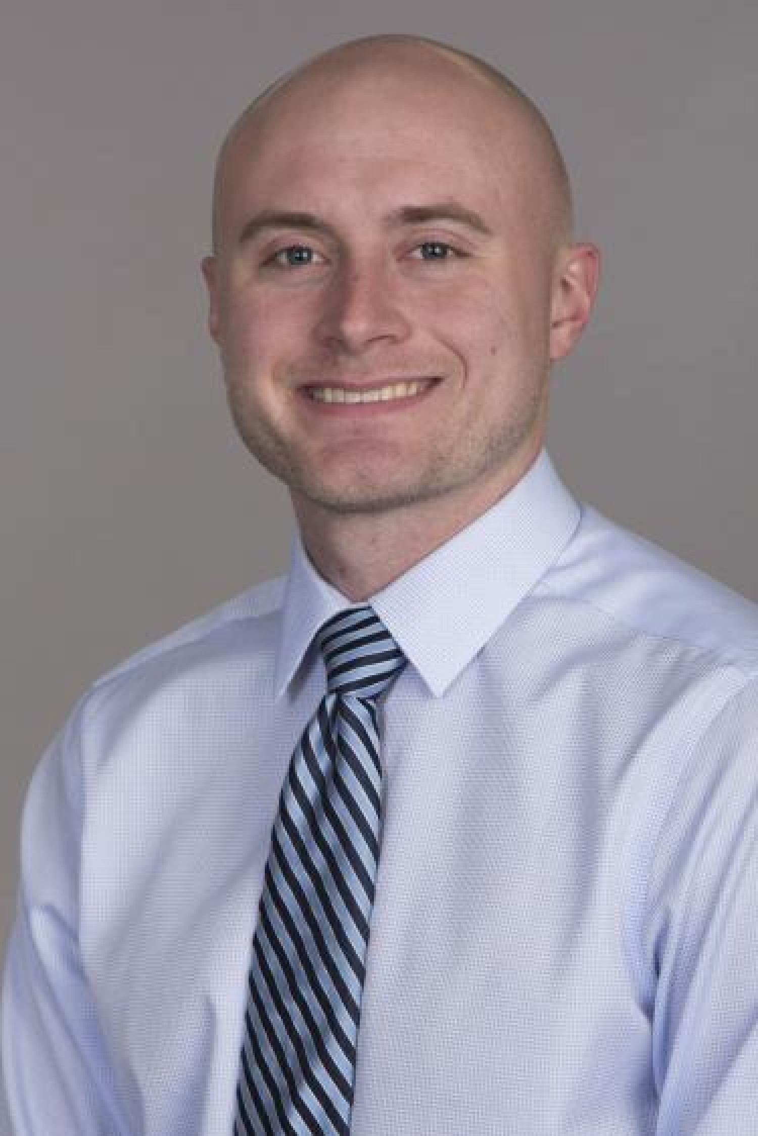 Kent Warren in blue shirt and striped tie