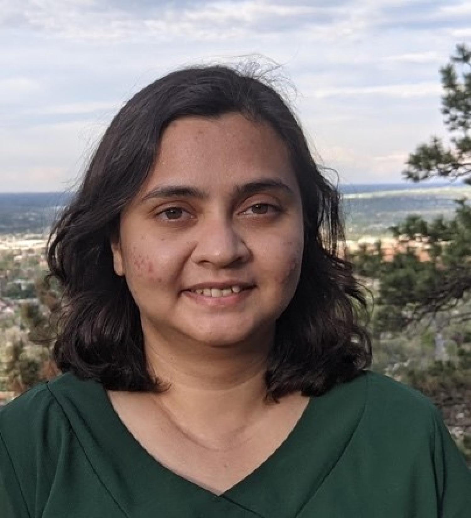 Nabila Tanjeem in green shirt outside