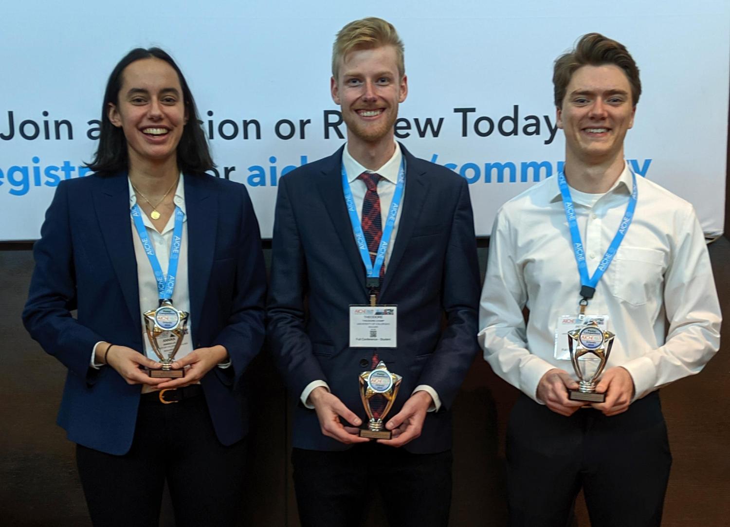 Annika Lai, Theodore Champ and Peter Buur stand with their poster awards at AIChE conference