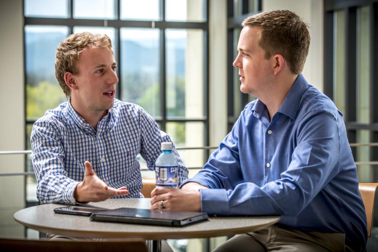 An alumnus meets with a student in the mentoring program.