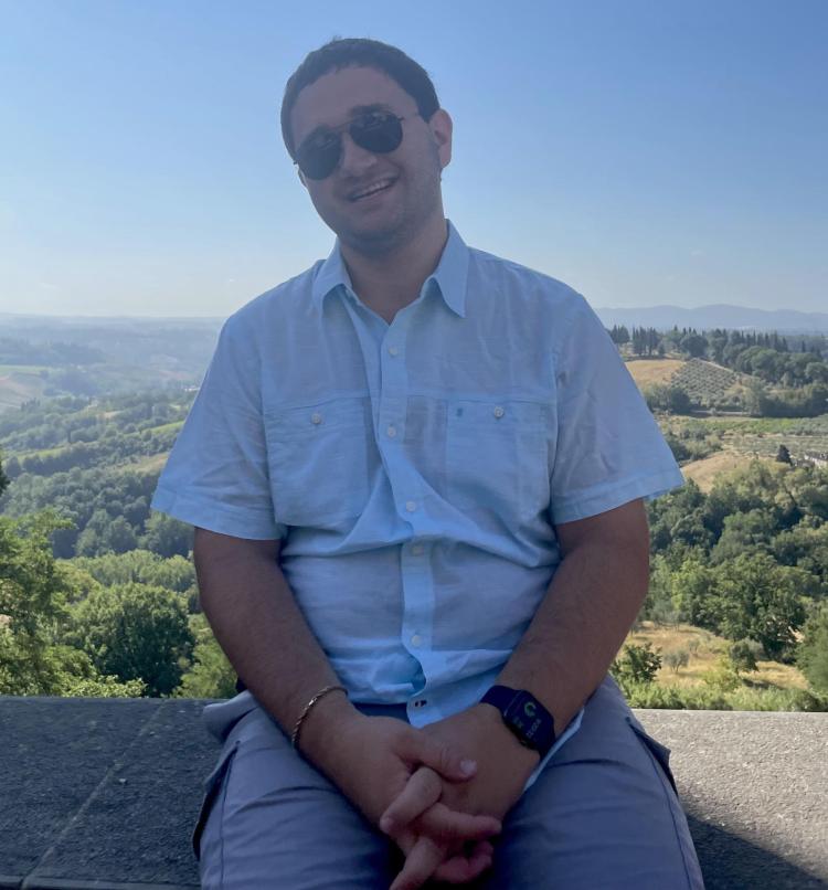 Daniel Rivkin with a mountain view behind him.