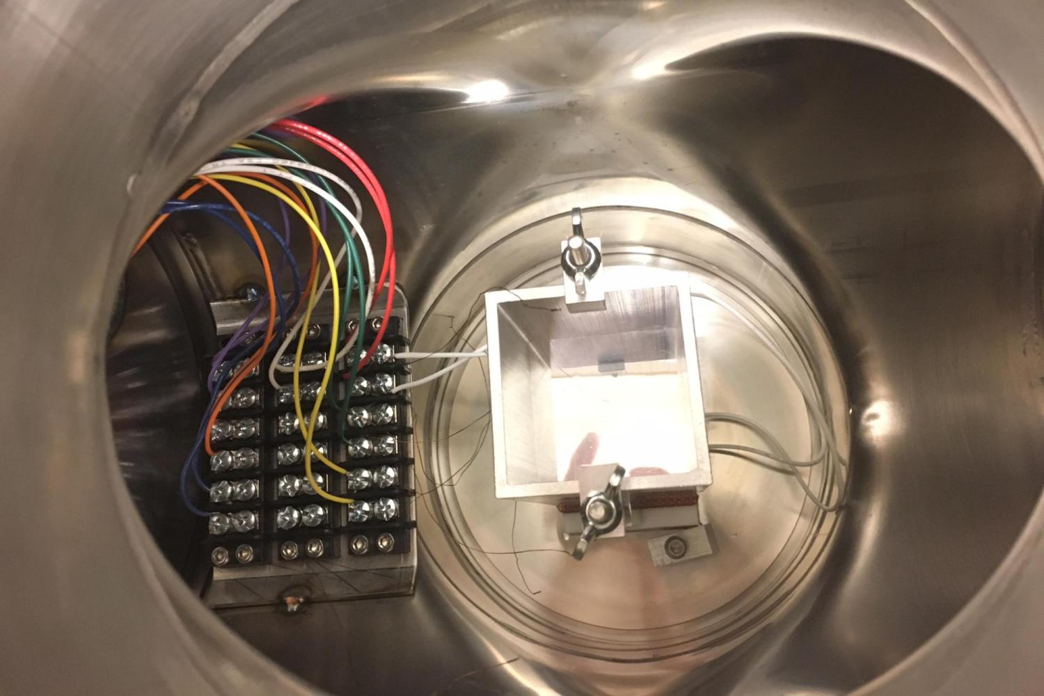 Multicolored wires set within a duct system.