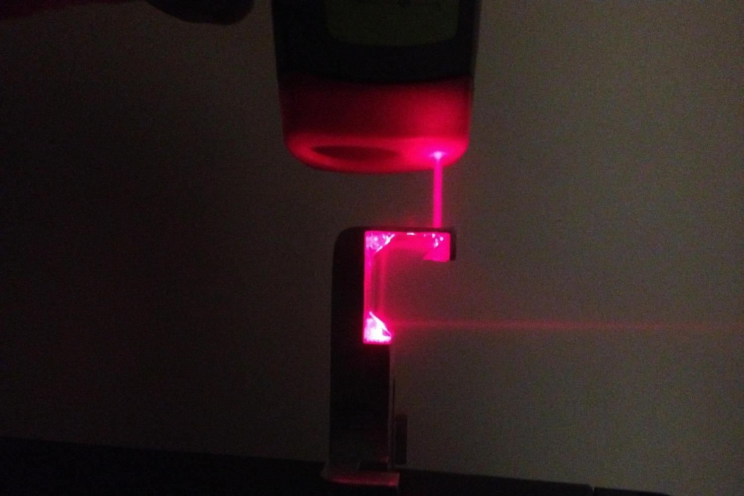 A light bender redirecting purple light.