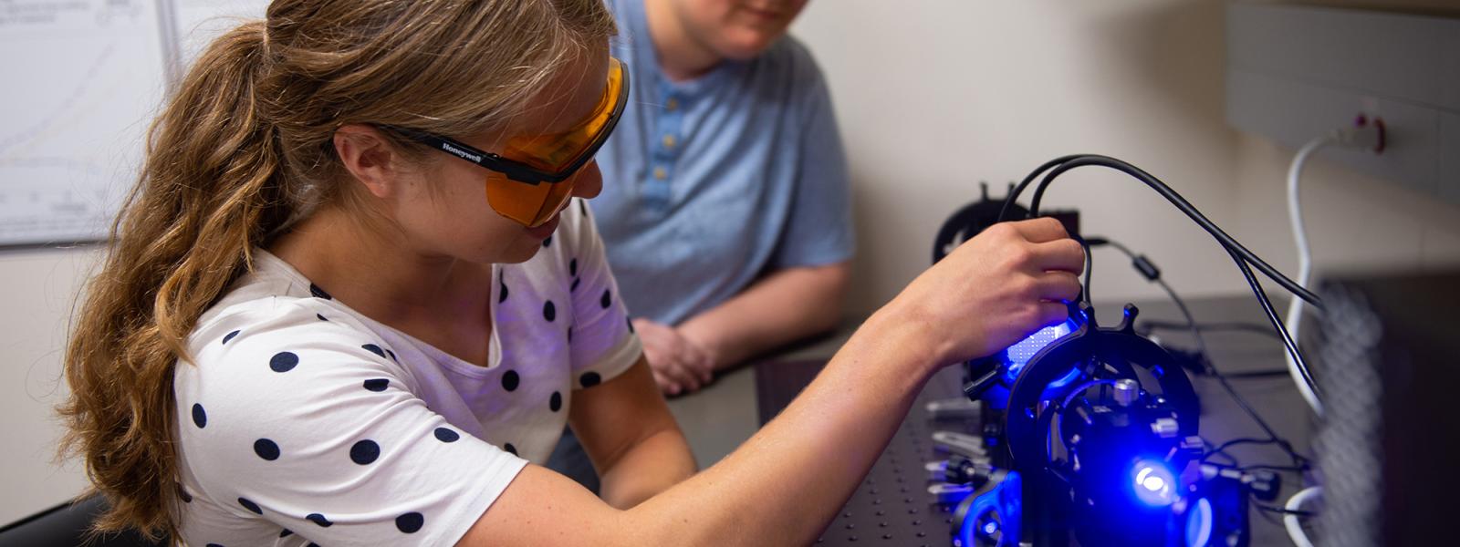 Grad students with lab equipment