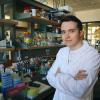 Albert Velasco Abadia wearing a lab coat in the lab