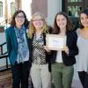 Society of Women Engineers members and a certificate.