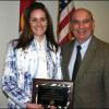 Frannie Ray Earle receives award from chancellor Phil DiStefano.