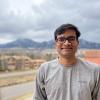 Kaustav Bera with the mountains blurred in the background