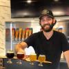 Jason Slingsby serves up beer at his brewery