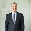 Martin Bazant in front of white board with notes