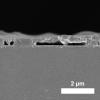 Cross-sectional SEM image of the spin-coated MAPbI3 film processed from DMF precursor solution (annealed for 5 s at 100 °C) on a PTAA-covered ITO glass substrate.