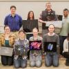 The contestants pose with their entries
