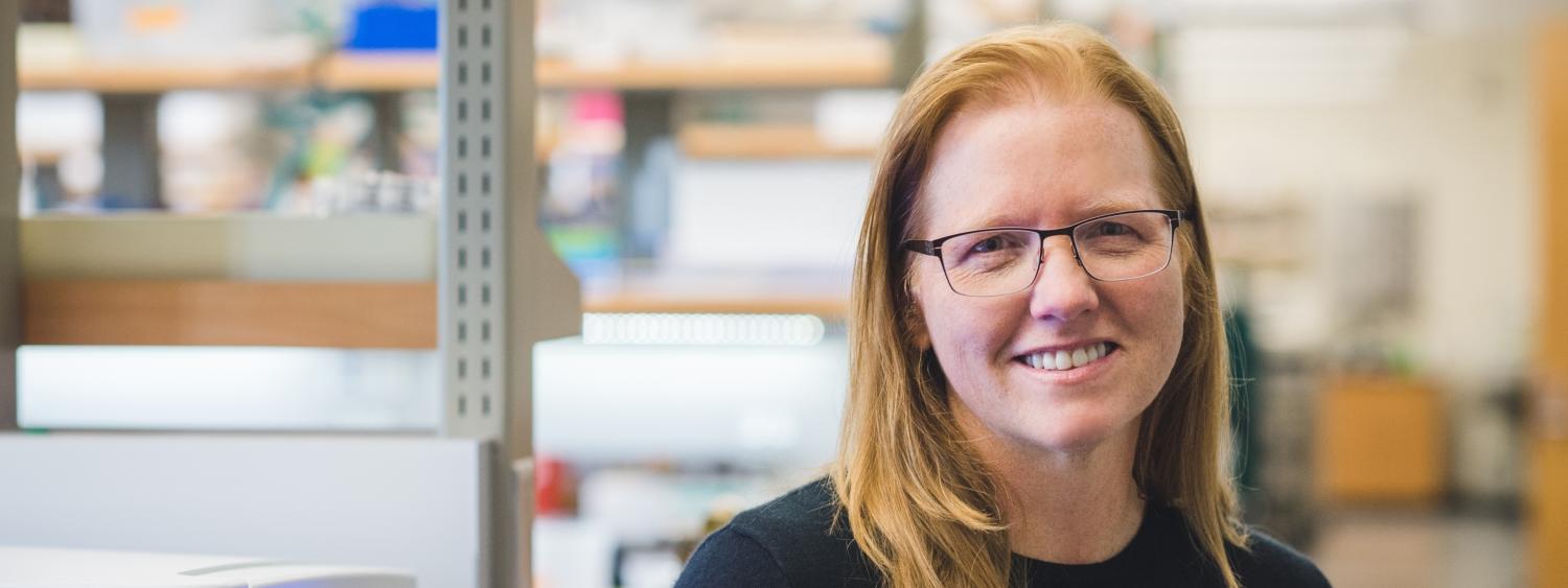 Kristi Anseth with her lab blurred in the background