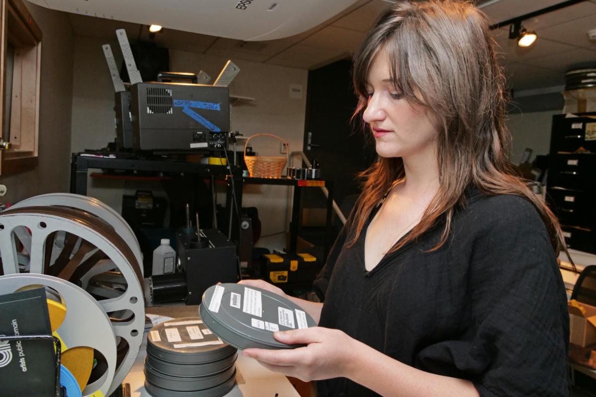 Student Employee working with film canisters