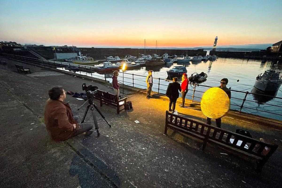 Students making a movie on the river in Scotland