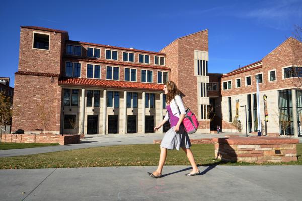 Student walking on CU Boulder's campus 