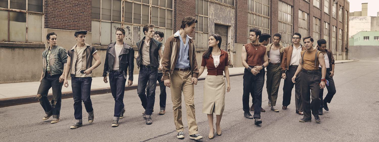 The Cast of Steven Spielberg's 2020 adaptation of West Side story. The Sharks and Jets oppose each other with Tony and Maria standing between them in New York City 