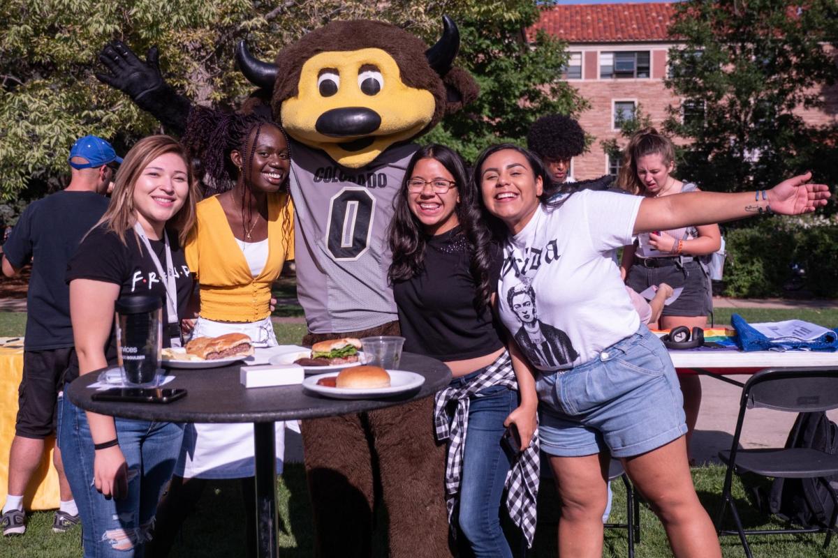 Students with Chip, the mascot, at campus event