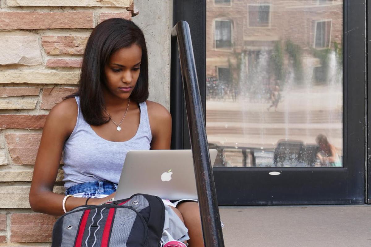 student studying on steps near UMC