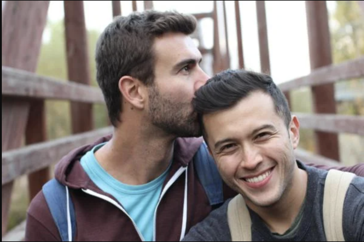 Two men in an embrace.