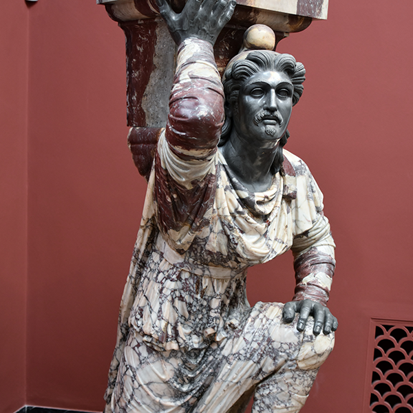 statue of a kneeling barbarian, Richard Mortel from Riyadh, Saudi Arabia, CC BY 2.0 <https://creativecommons.org/licenses/by/2.0>, via Wikimedia Commons