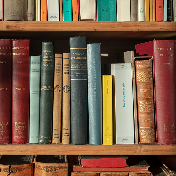 part of a bookshelf containing books by ancient philosphers, Roman Eisele, CC BY-SA 4.0 <https://creativecommons.org/licenses/by-sa/4.0>, via Wikimedia Commons