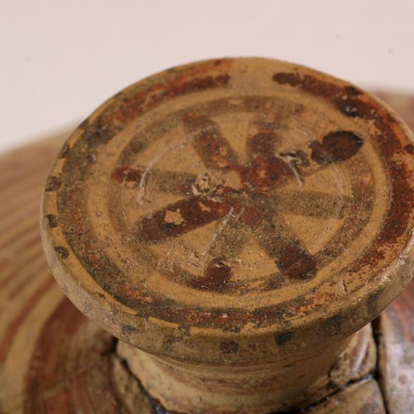 detail of lid handle with rosette