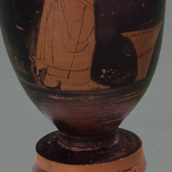 foot of vase and feet or woman