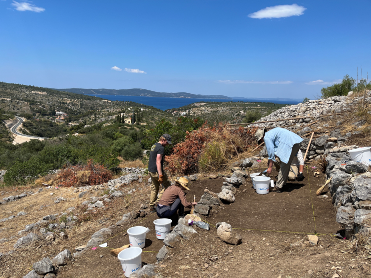 Excavations on the terraces in 2022 with a view to the site’s harbor and across the straits to the island of Šolta