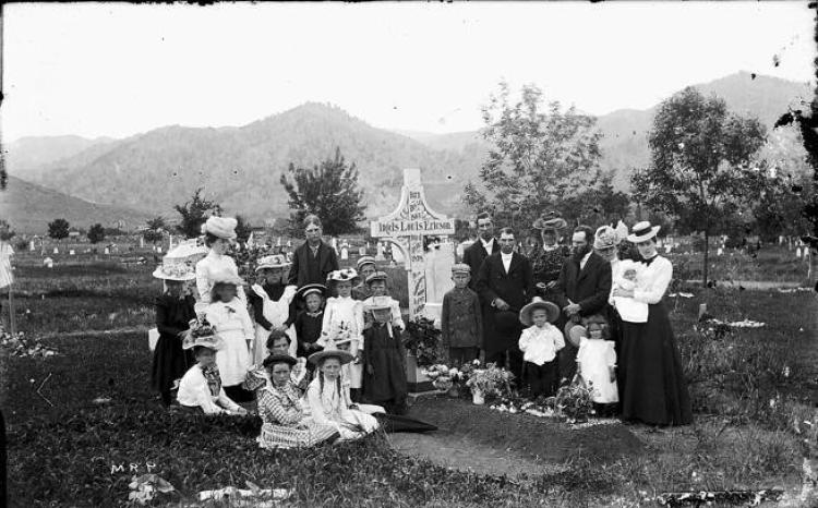 Historic photo of family at gravesite