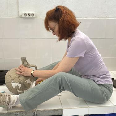 Beth Dusinberre examining a pot from Gordion