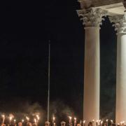 Image of students marching with torches at a university