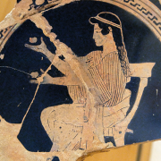 seated girl juggling on the side of a potsherd, Regional Archaeological Museum Antonino Salinas, CC BY 2.5 <https://creativecommons.org/licenses/by/2.5>, via Wikimedia Commons