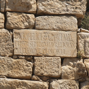 latin inscription on a block in tunisia, Graham Claytor / Institute for the Study of the Ancient World, CC BY 2.0 <https://creativecommons.org/licenses/by/2.0>, via Wikimedia Commons