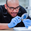 Larry Gill examining coins