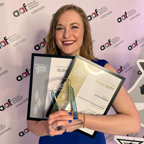 Kate Chambers with an armful of awards.
