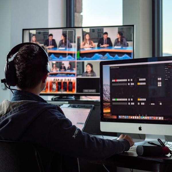 Journalism student works on computers