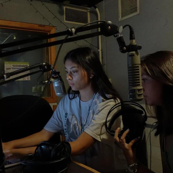Connections students Jaena Moore and Sara Marquez practice going on air on Radio 1190, the campus radio station housed in the University Memorial Center.