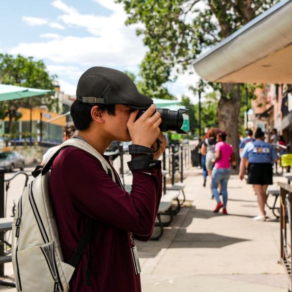 Student Lhaten Wood takes a photo near campus during a photography class in the Connections summer program.