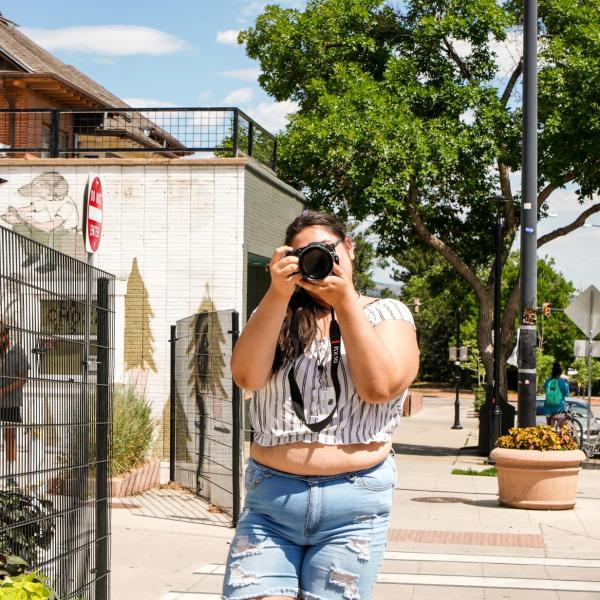 Connections student Hannah Martin takes street photos during a photography class taught by Eric Coombs Esmail, an instructor in the Department of Critical Media Practices.
