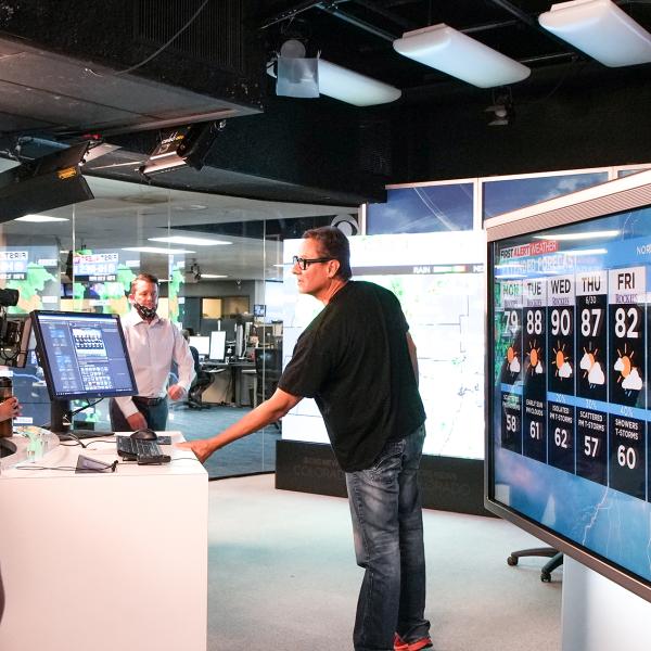 CBS4 meteorologist Dave Aguilera shows Pathways students the meteorology studio.
